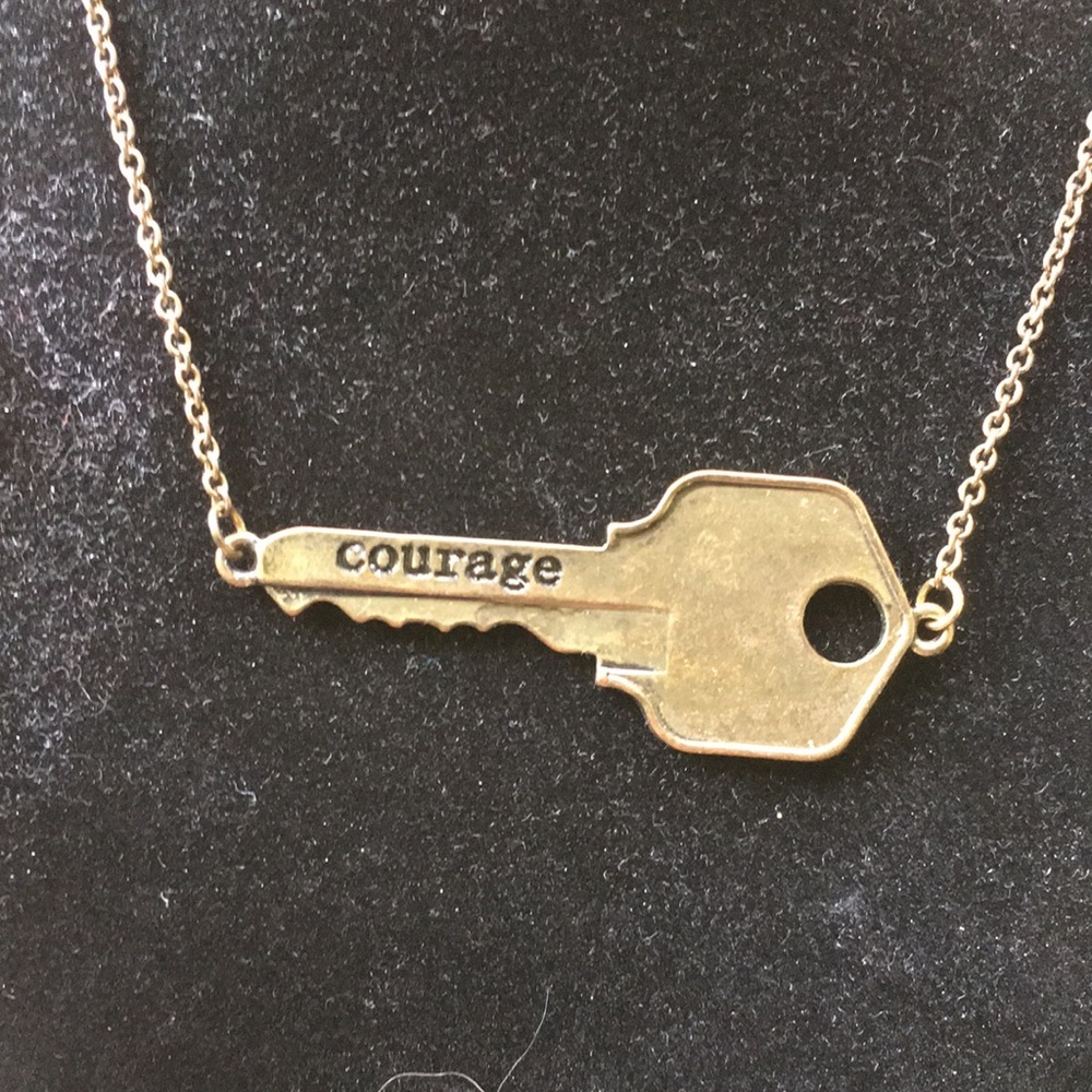 Brass key necklace stamped with “courage”